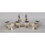 A George VI silver eight part condiment set comprising of a pair of pepperettes, a pair of mustard