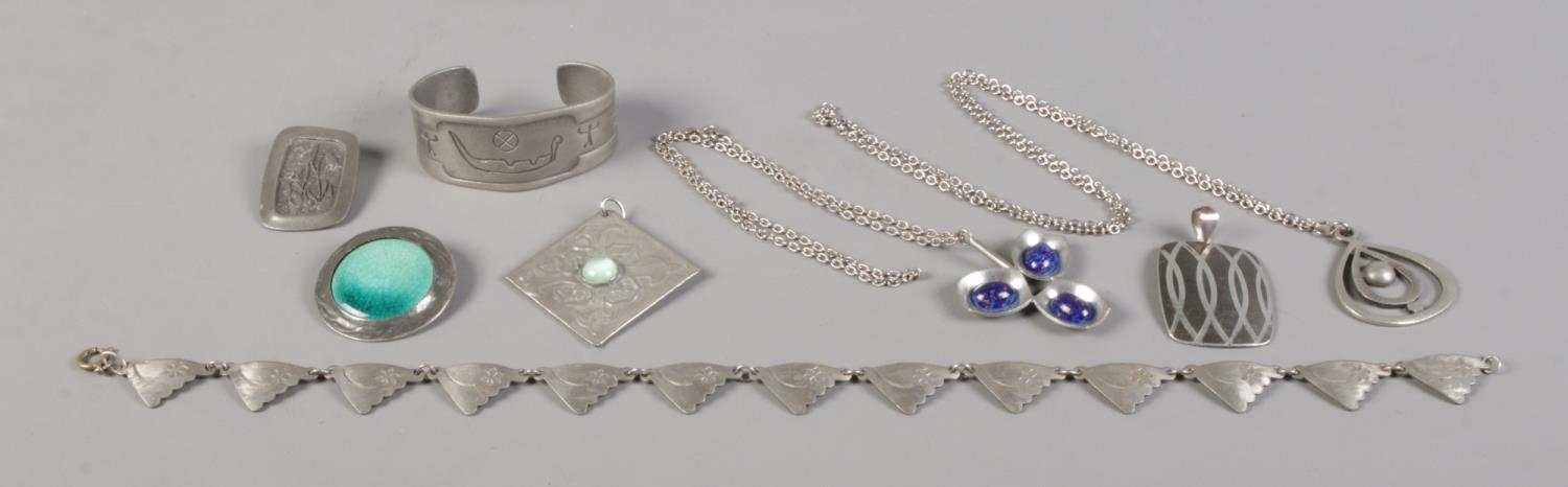 A collection of Scandinavian pewter jewellery, to include Jensen and R.Tenn examples.