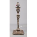 A late 19th century silver candlestick of Neo Classical design. Later converted to a table lamp.