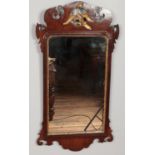 A George III mahogany fret mirror with gilt Hoho bird decoration. 92cm x 49cm. Later glass