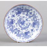 A Chinese dish decorated in underglaze blue with Qilins, bearing six character Zhengde marks to