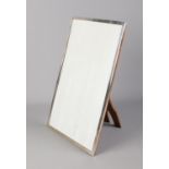 A large silver easel photograph frame. Stamped Silver. 46cm x 31cm.