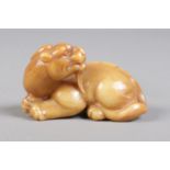 A Chinese carved soapstone figure of a mythical beast. Height 3cm, Length 6cm.