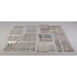 A comprehensive collection of assembled silver cutlery all with matching shell motif decoration,