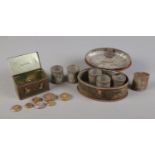 A vintage spice tin with tins and money box with weights.
