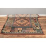 A multicoloured ground wool rug with geometric design. (162 cm width 230cm length)