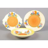 Three pieces of Clarice Cliff Autumn Crocus pottery. Desert bowl and two side plates, one in the