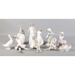 A collection of ten Nao by Lladro figures. To include ballerinas, lady with umbrella and Goose