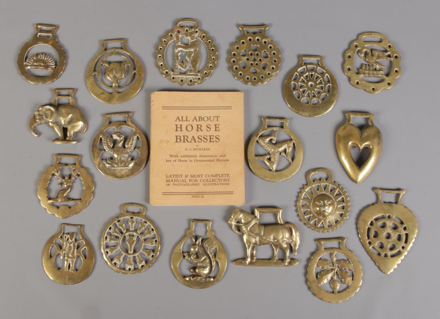 A quantity of horse brasses, together with collectors book.