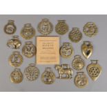 A quantity of horse brasses, together with collectors book.