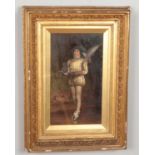 A gilt framed 19th century oil on canvas behind glass, depicting a boy in period clothing carrying a