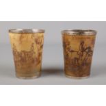 Two white metal mounted horn hunting cups. One carved with a fox hunting scene with inscription to