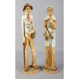 A pair of L Toni Italian figures of a man and woman. H:51cm. Both figures are signed.