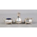 A George V three part condiment set comprising of pepperette, mustard pot and salt (both with