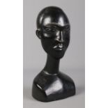 An African tribal carved ebony bust of a man. Label to base attributing the work to Osei Bonsu,