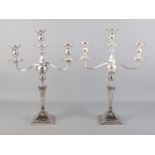A large pair of silver plated candelabra with detachable nozzles. Height 54cm.