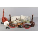A quantity of collectables. Including African wood carvings, tin plate crane, twisted