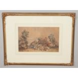 An ornate gilt framed watercolour depicting a rural village scene with figures in Victorian dress.