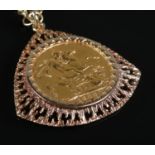 A Victorian full sovereign coin, dated 1900, in 9ct gold mount on 9ct chain. Weight 20.98g.
