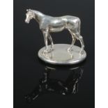 A silver model of a horse, possibly a car mascot. Assayed Chester 1925. 245g.