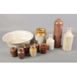 A box of assorted stoneware ink bottles and jars with an enamel basin etc.