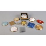 Twelve mid twentieth powder compacts, including boxed Stratton and Majestic examples.