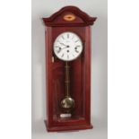 A Rapport mahogany cased wall clock.