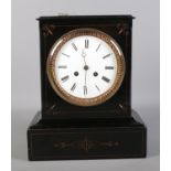 A Victorian black slate mantel clock. (with key)