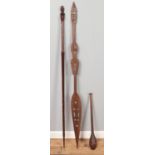 A small selection of Tribal pieces. To include a carved wooden staff with head decoration, a club