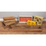 An assortment of wooden trays and concrete moulds.