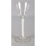 An 18th century wine glass with double opaque air twist stem. 15.5cm.