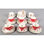 Five Alfred Meakin 'Red Sails' trios along with a matching cup and saucer and similar ceramics.