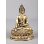 A 19th century Sino Tibetan bronze devotional statue of a seated Buddha raised on lotus plinth.