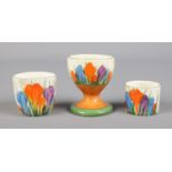 A Newport Pottery Clarice Cliff footed egg cup decorated in the Autumn Crocus design, along with