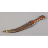 A Kindjahl type knife in scabbard. 23cm curved blade.