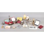 A small box of collectables. To include a Weston Master II light meter, a faux pearl necklace and