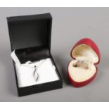 A Sterling Silver ring and necklace with paste stones. To include a decorative ring (Size N 1/2) &