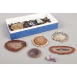 A box of loose gemstones. Including blue john, amethyst, etc.