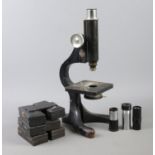 A Beck of London Microscope. Model no 10. Comes with extra lenses and slide boxes. H: 32.5cm. Lenses