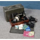 A 1930s Singer 99K sewing machine in case with accessories. Including mat, spare light, motor etc.