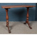 A Victorian mahogany console table, with turned legs supporting scrolled feet. Height: 72cm,