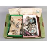 Two boxes containing an assortment of costume jewellery, including earrings, bangles etc.