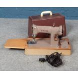 A Singer 185K electric sewing machine, with case and key.