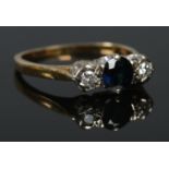 An 18ct Gold Sapphire and Diamond three stone ring. Size KÂ½. Total weight: 2.48g