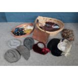 Two baskets of assorted vintage items. To include a Harris Tweed gent's hat, a Waldy leather bag and