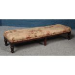 A Victorian upholstered mahogany double footstool.
