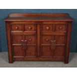 A carved oak sideboard. (91cm x 122cm)