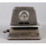 A vintage International Time Recorder Model 2100 clocking in machine.