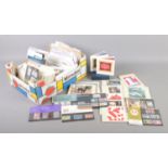 A box of assorted stamps, postcards and 1st day covers etc. To include a good selection of postcards