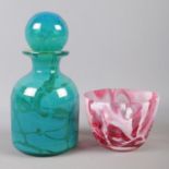 A mid 20th Century Mdina glass bottle of rounded form with collar neck and spherical ball stopper